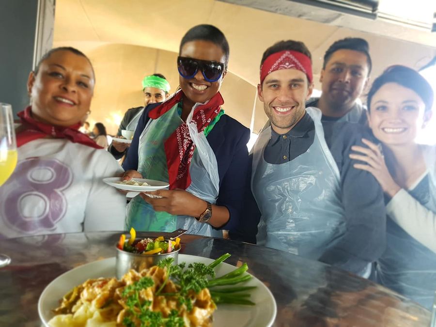 Team building group taking part in a cook-off challenge