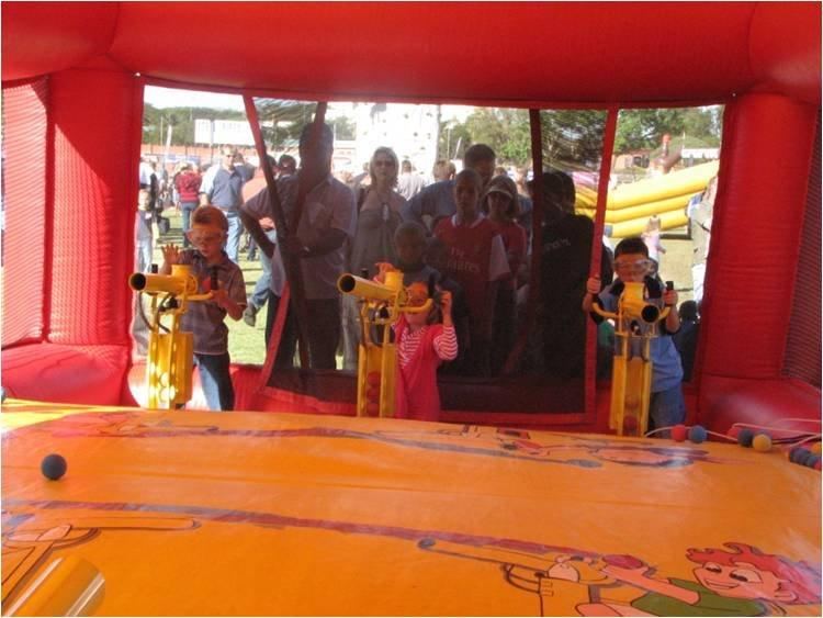 Team building group playing an inflatable target shooting game